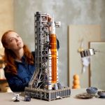 Picture Of Completed Artemis Rocket LEGO Set With Woman In Background